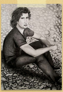 Young Man Sitting on Rocks by Mar�a Jes�s Rivera